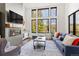 Inviting living space with a cozy fireplace, scenic views, and a telescope for stargazing at 581 Fairview Blvd, Breckenridge, CO 80424