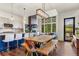 Open-concept living area with a large dining table and views of the mountains at 581 Fairview Blvd, Breckenridge, CO 80424