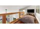 Comfortable loft with hardwood floors, wood railing and view of the great room below at 581 Fairview Blvd, Breckenridge, CO 80424