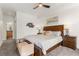 Comfortable primary bedroom with hardwood furnishings, ceiling fan, and an attached bathroom at 581 Fairview Blvd, Breckenridge, CO 80424