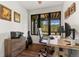 Bright office space with mountain views, hardwood floors, and rustic wood desk perfect for working from home at 581 Fairview Blvd, Breckenridge, CO 80424