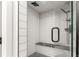 Beautifully tiled shower with glass door and black hardware, including a comfortable shower bench at 581 Fairview Blvd, Breckenridge, CO 80424