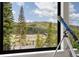 Scenic view of mountains and landscape from a window with a telescope at 581 Fairview Blvd, Breckenridge, CO 80424