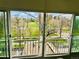 Inviting balcony view overlooking lush green space and walking path on a sunny day at 1200 N Humboldt St # 604, Denver, CO 80218