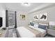 Cozy bedroom with city views, modern art, and comfortable, neutral-toned furnishings at 1200 N Humboldt St # 604, Denver, CO 80218