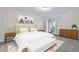 Comfortable bedroom featuring neutral tones, soft carpet, and a view to the outside balcony at 1200 N Humboldt St # 604, Denver, CO 80218