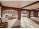 Arched brick entrance with a bench and gated access to the street at 1200 N Humboldt St # 604, Denver, CO 80218