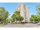 Well-maintained Sun Terrace Condominiums with mature trees lining the street at 1200 N Humboldt St # 604, Denver, CO 80218