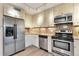 Well-appointed kitchen with stainless steel appliances, granite counters and light wood cabinetry at 1200 N Humboldt St # 604, Denver, CO 80218