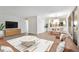 Open floor plan connecting the living room, dining area, and kitchen with neutral colors and modern design at 1200 N Humboldt St # 604, Denver, CO 80218