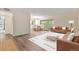 Bright living room with hardwood floors, large windows, and access to a dining area at 1200 N Humboldt St # 604, Denver, CO 80218