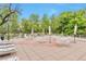 Large patio area offering tables, chairs, umbrellas, and lounge chairs for outdoor relaxation at 1200 N Humboldt St # 604, Denver, CO 80218