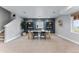 Open dining area with decor shelves, carpeted floor, and a large window that provides natural light at 5591 Farrier Pt, Castle Rock, CO 80104