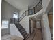 Grand foyer featuring high ceilings, hardwood flooring, a contemporary staircase, and ample natural light at 5591 Farrier Pt, Castle Rock, CO 80104