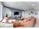 A cozy living room with comfortable seating, modern decor, and a television, perfect for relaxing at 5591 Farrier Pt, Castle Rock, CO 80104