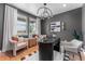 Stylish home office featuring modern decor, ample natural light, and a comfortable workspace at 5591 Farrier Pt, Castle Rock, CO 80104