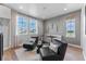 Cozy sitting room with comfortable seating, stylish decor, and large windows with a view at 5591 Farrier Pt, Castle Rock, CO 80104