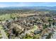 Stunning aerial view of a charming neighborhood with mature trees and mountain views at 2477 S Dover Way, Lakewood, CO 80227