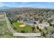 Aerial shot showcasing nearby community park and elementary school, near a lovely neighborhood at 2477 S Dover Way, Lakewood, CO 80227