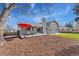 Expansive backyard with well maintained lawn, patio area, and mature trees at 2477 S Dover Way, Lakewood, CO 80227