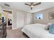 Cozy bedroom with closet space and a view into the rest of the house at 2477 S Dover Way, Lakewood, CO 80227