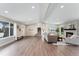 Inviting living room with ample natural light, a modern fireplace, and an open layout at 2477 S Dover Way, Lakewood, CO 80227