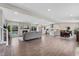 Open concept living space featuring a fireplace, a kitchen, and a dining area at 2477 S Dover Way, Lakewood, CO 80227