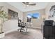 Bright office space featuring a ceiling fan, desk with computer, a comfortable chair, and natural light from the window at 2477 S Dover Way, Lakewood, CO 80227