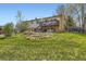 Expansive backyard featuring a deck, lush lawn, and partial fencing, perfect for outdoor enjoyment at 6477 W Clifton Pl, Littleton, CO 80128