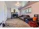 Finished basement featuring a fireplace and natural light at 6477 W Clifton Pl, Littleton, CO 80128