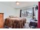 Bedroom with soft carpet and large window with views at 6477 W Clifton Pl, Littleton, CO 80128