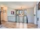 The foyer boasts wood floors and a decorative railing overlooking the front door at 6477 W Clifton Pl, Littleton, CO 80128