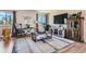 Comfortable living room with modern décor, plush rug and rocking chair at 6477 W Clifton Pl, Littleton, CO 80128