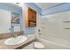 Bathroom features a granite vanity, tub, and medicine cabinet with towels and art at 8050 Niwot Rd # 40, Niwot, CO 80503
