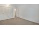 Bedroom featuring neutral carpet and a closet with white bi-fold doors at 8050 Niwot Rd # 40, Niwot, CO 80503