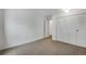 Neat bedroom with neutral carpet, closet space, and freshly painted walls for a minimalist design at 8050 Niwot Rd # 40, Niwot, CO 80503