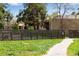 Exterior view of property surrounded by a wooden fence and green grass at 8050 Niwot Rd # 40, Niwot, CO 80503