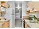 Efficient kitchen layout with ample storage, appliances, and connection to the living area at 8050 Niwot Rd # 40, Niwot, CO 80503
