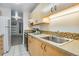 Kitchen showcasing wooden cabinets, stainless steel sink, and mosaic backsplash for a modern look at 8050 Niwot Rd # 40, Niwot, CO 80503