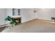 Carpeted living room with fireplace, sliding glass doors to balcony, and a plant in the corner at 8050 Niwot Rd # 40, Niwot, CO 80503