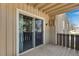 Covered patio with sliding glass doors and views of the surrounding greenery at 8050 Niwot Rd # 40, Niwot, CO 80503