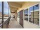 View of the building's balcony featuring black railings, windows, and a decorative security door at 384 S Ironton St # 314, Aurora, CO 80012