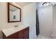 Bathroom featuring a sleek vanity and a shower behind the door for maximum usage of space at 384 S Ironton St # 314, Aurora, CO 80012