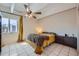 Cozy bedroom with a ceiling fan, natural light, and a modern aesthetic on white tile at 384 S Ironton St # 314, Aurora, CO 80012