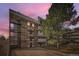 Low-rise condo building at dusk with a mix of modern and classic architecture at 384 S Ironton St # 314, Aurora, CO 80012