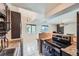Open kitchen with stainless steel stove, granite countertops, and easy access to the living area at 384 S Ironton St # 314, Aurora, CO 80012