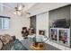 Bright living room with a decorative fireplace, ceiling fan, and tiled floor at 384 S Ironton St # 314, Aurora, CO 80012