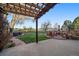 Enjoy outdoor living in this backyard with patio, hot tub and fire pit at 5270 Tabor St, Arvada, CO 80002
