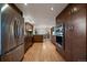 Open kitchen with stainless steel appliances, hardwood floors, and custom wood cabinets throughout at 5270 Tabor St, Arvada, CO 80002