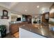 Modern kitchen featuring stylish cabinets, stainless steel appliances, and an open layout to the living room at 5270 Tabor St, Arvada, CO 80002